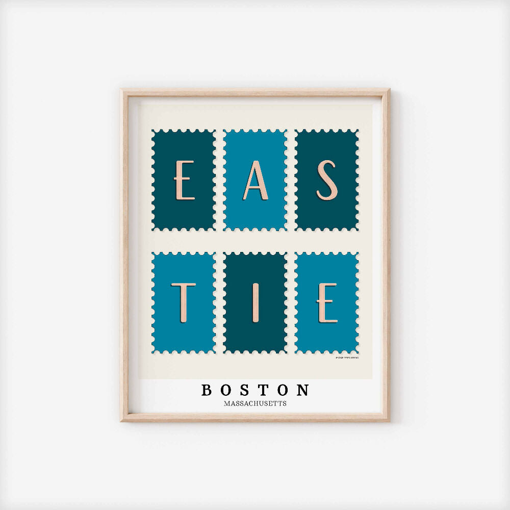 A framed picture of postage stamps featuring the Eastie neighborhood in Boston, Massachusetts drawn in a unique lettering style. Artwork has a blue and white color scheme