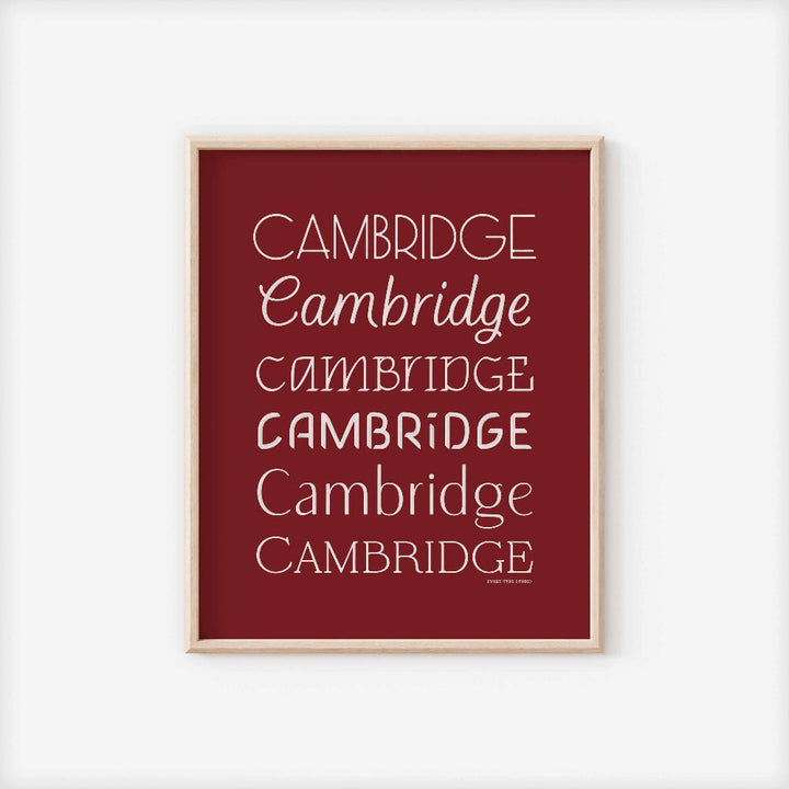 A framed picture of the word "Cambridge" drawn in various lettering styles. Artwork has a red and white color scheme
