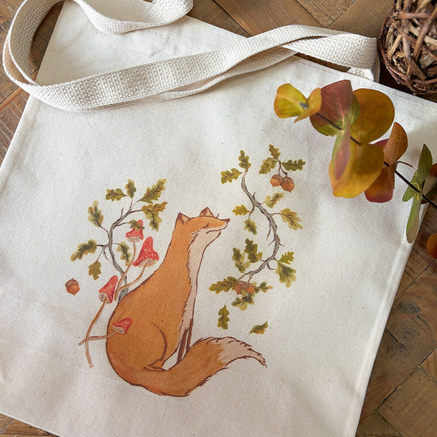 Artist illustration of fox sitting among autumn leaves, branches and acorns