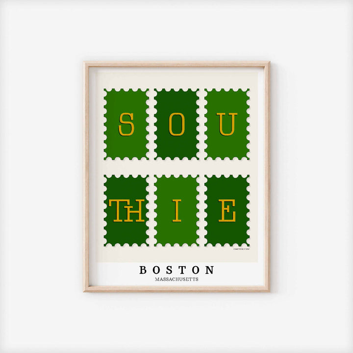 A framed picture of postage stamps featuring the Southie neighborhood in Boston, Massachusetts drawn in a unique lettering style. Artwork has a green and gold color scheme